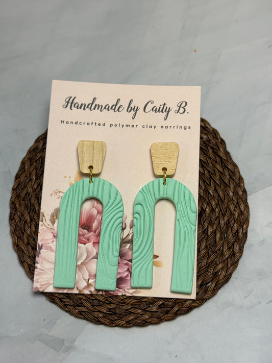 teal arch with wooden tops