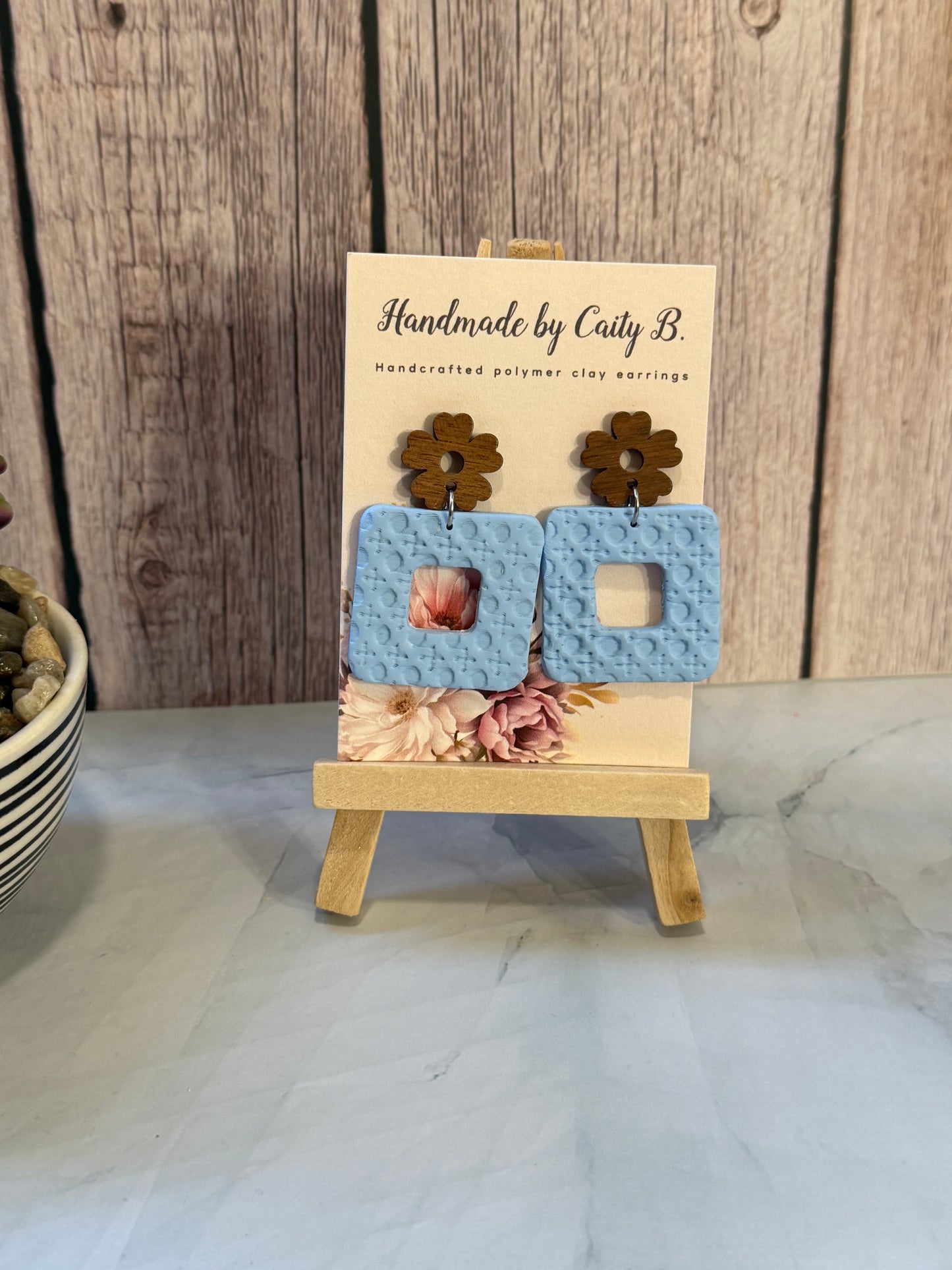 square rattan pattern earrings with wooden flower tops