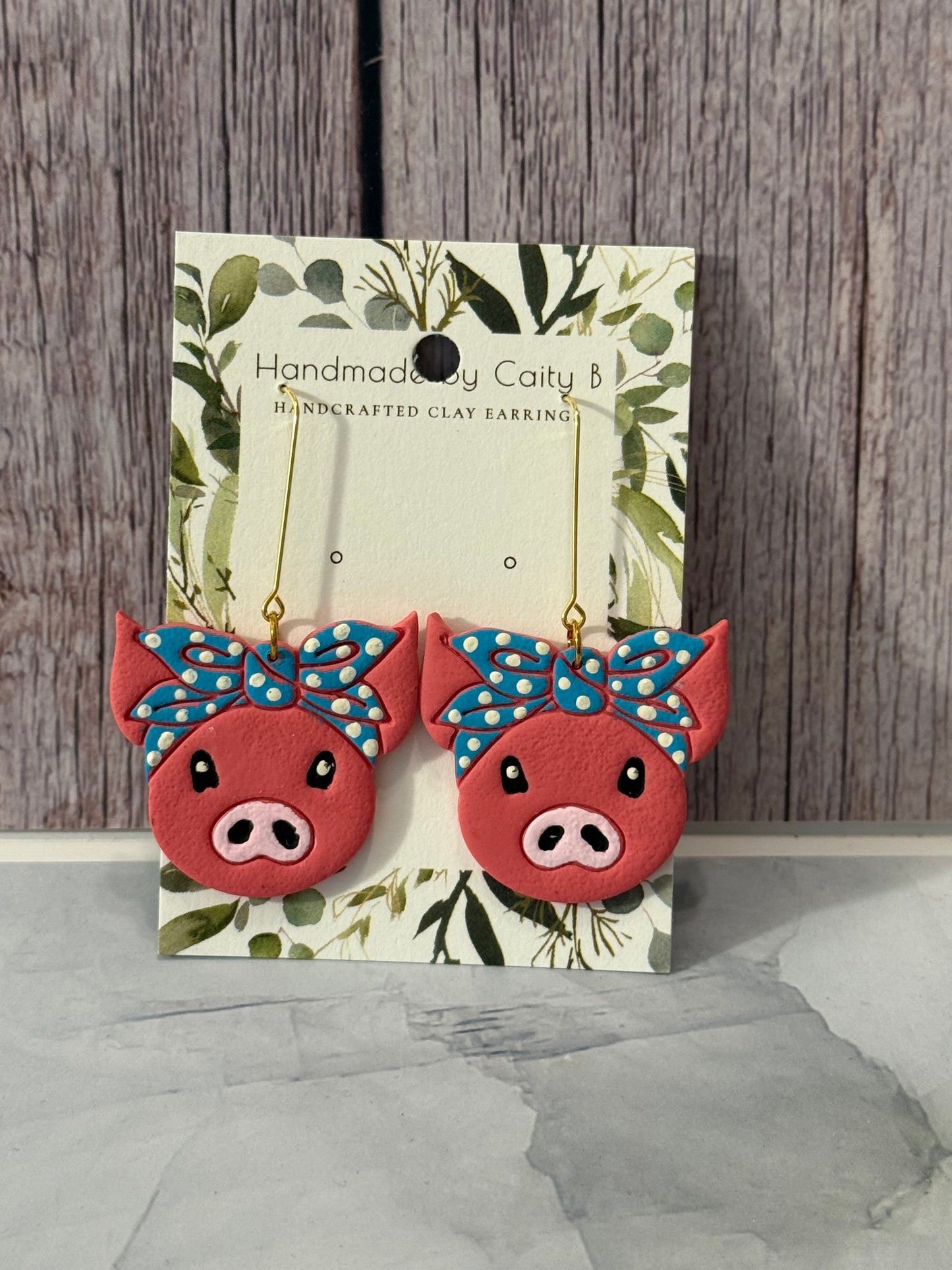 pigs with blue polka dot bandanas