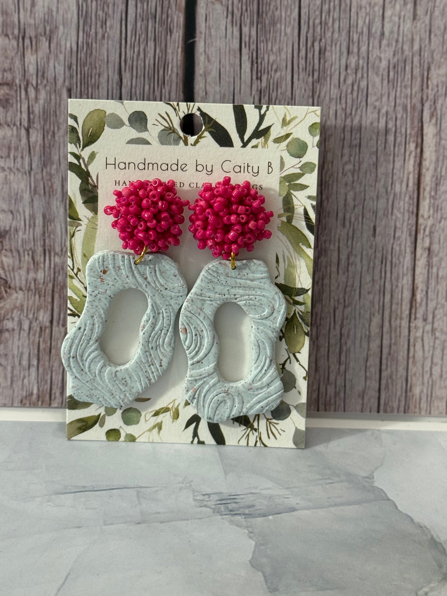 gray and gold swirls with pink top