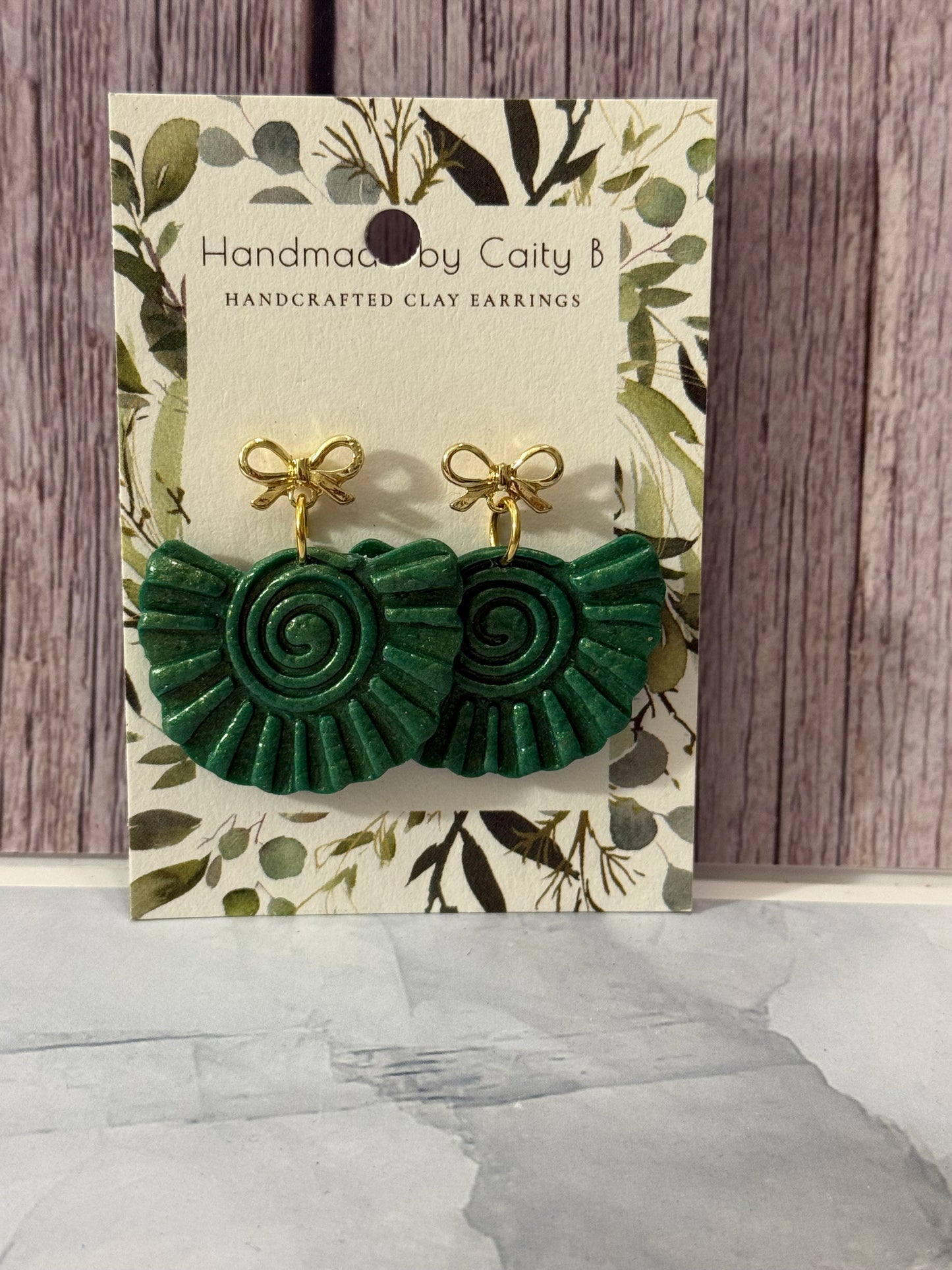 green and gold dangle with gold bow