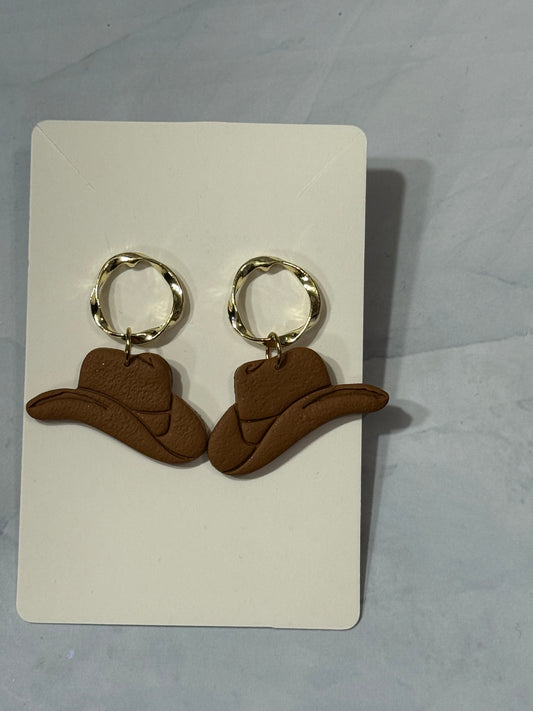 Cowboy hats with gold circle tops