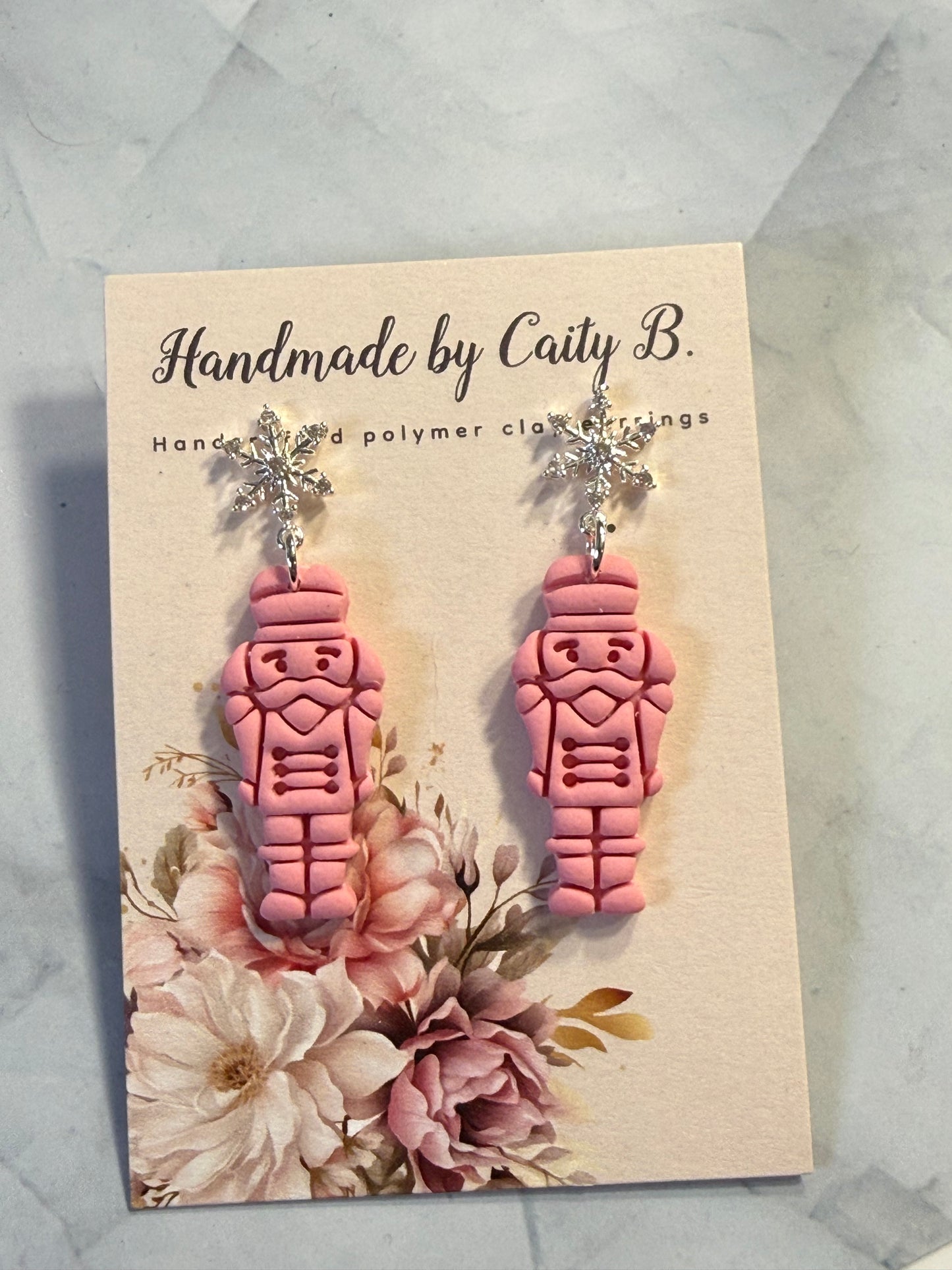 pink nutcrackers with snowflake tops