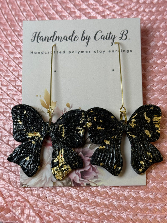 black and gold sparkle bows