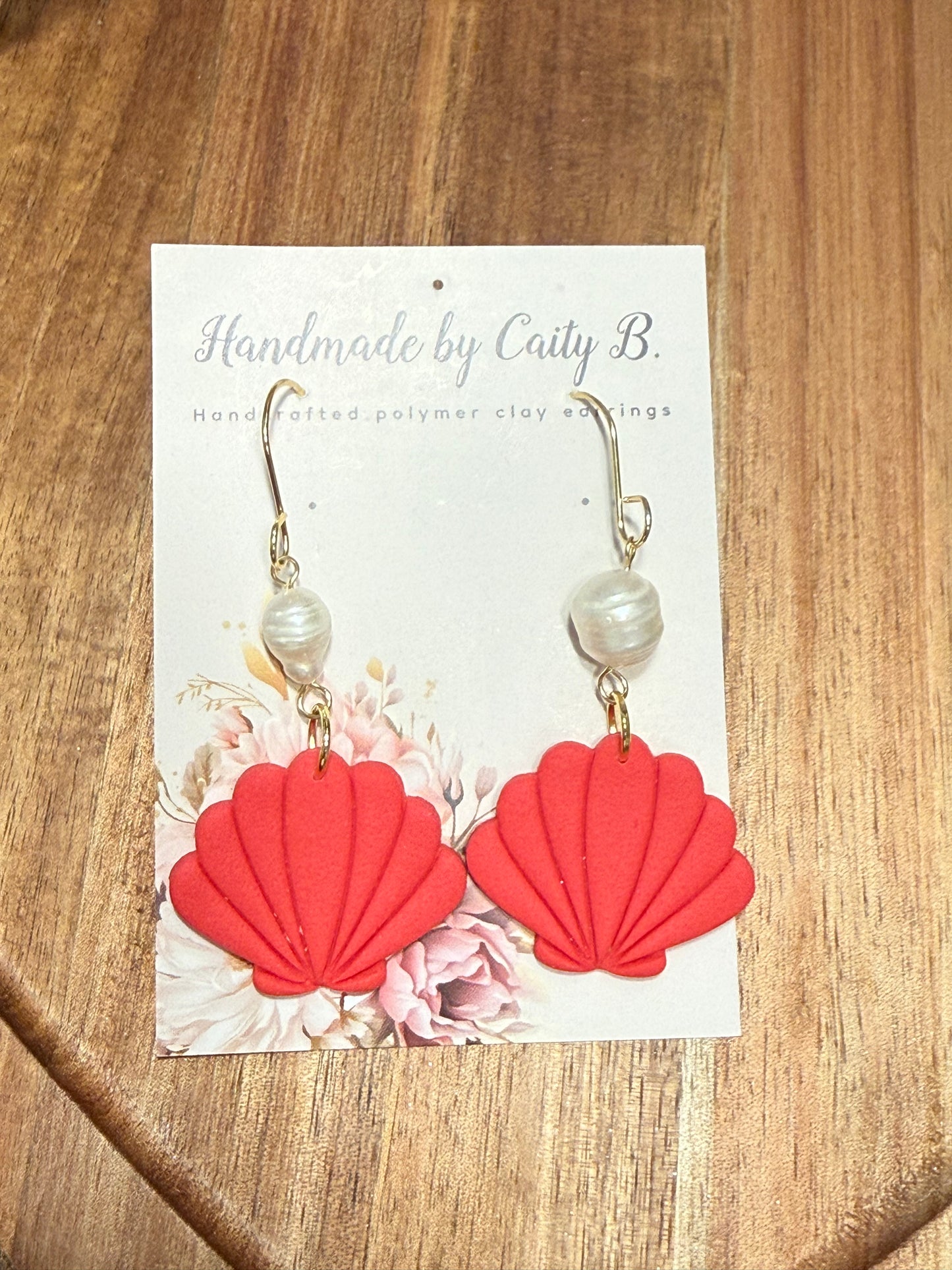 seal shell with pearl charms and gold dangles