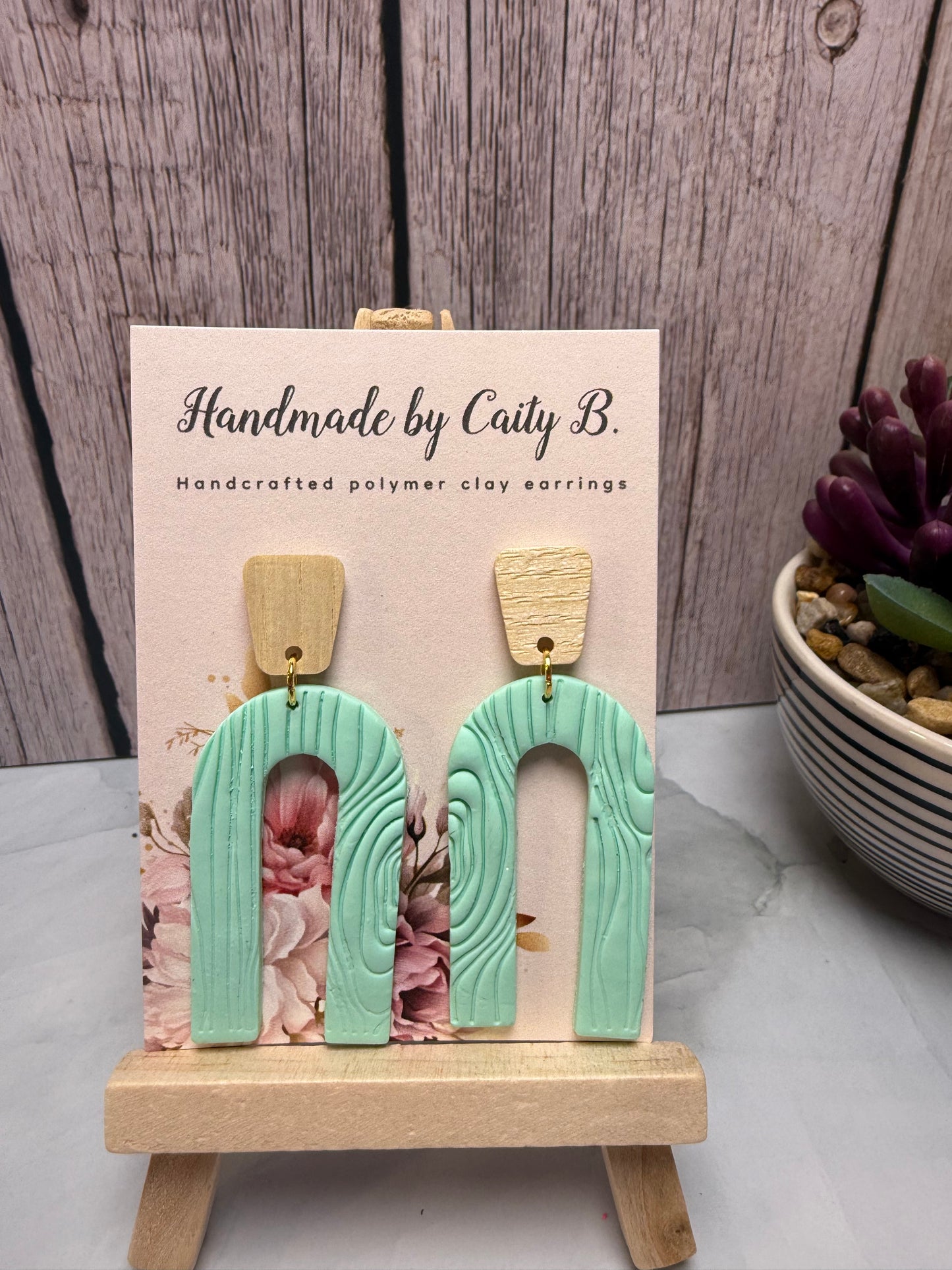 teal arch with wooden tops