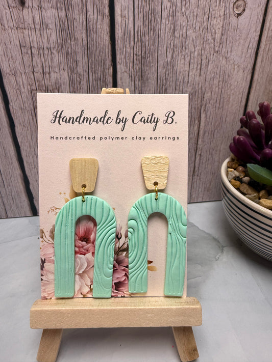 teal arch with wooden tops