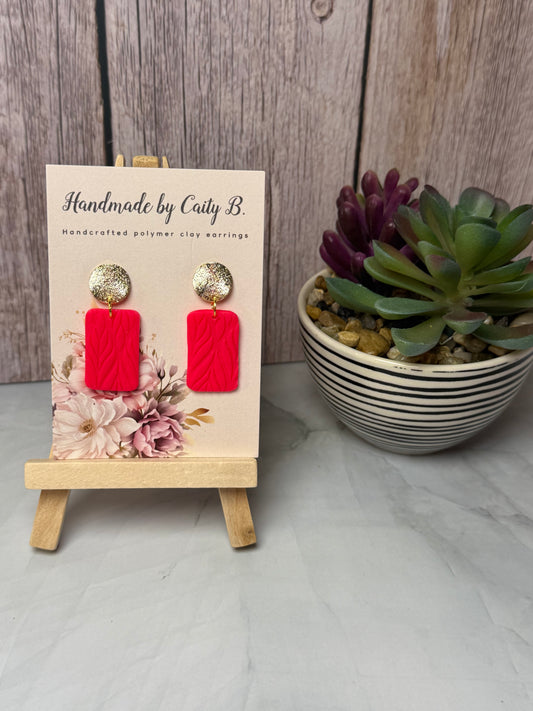 Pink textured earrings with gold circle top