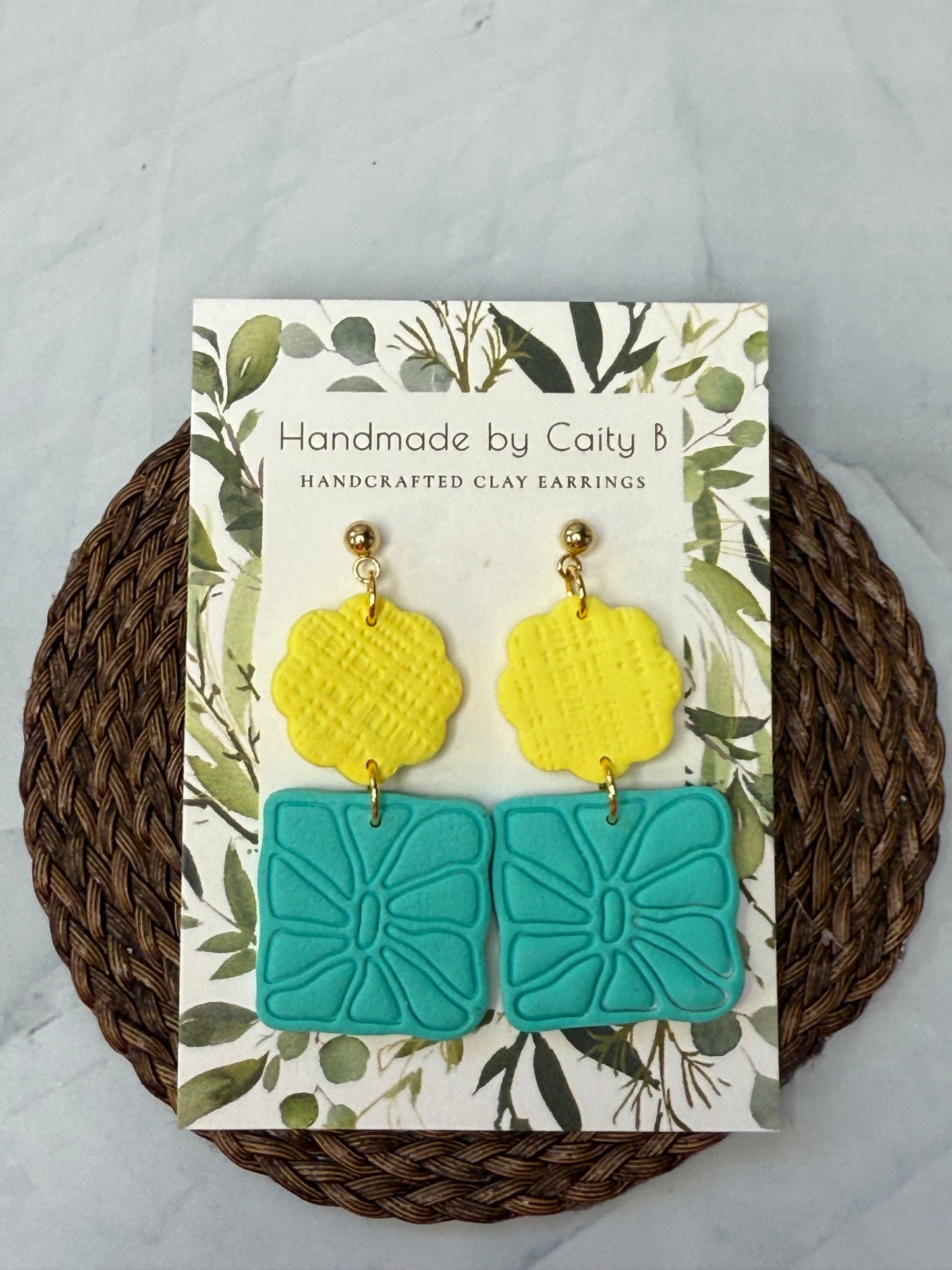 Stacked yellow scallop and teal flower earrings