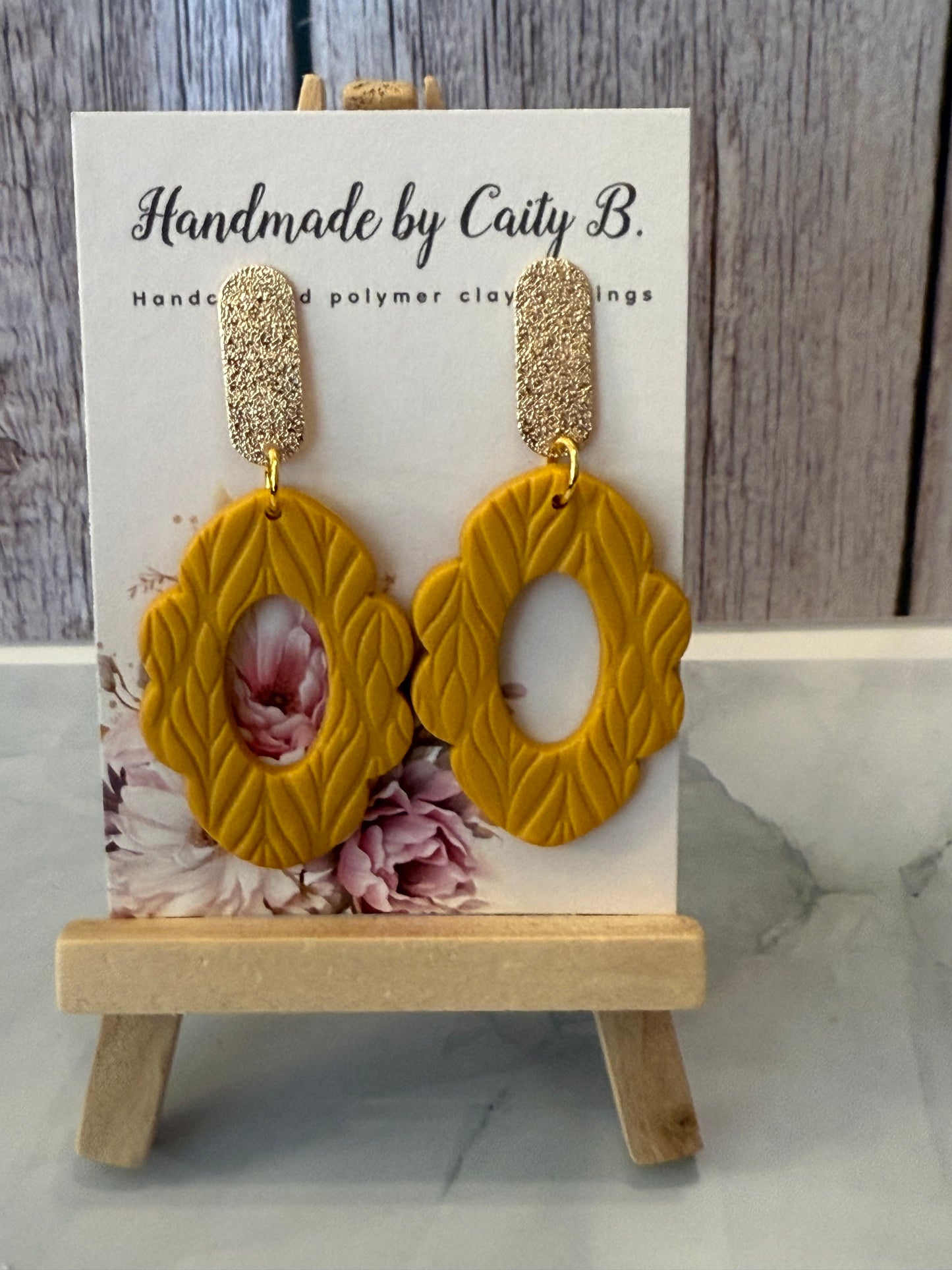 textured golden scalloped oval dangles