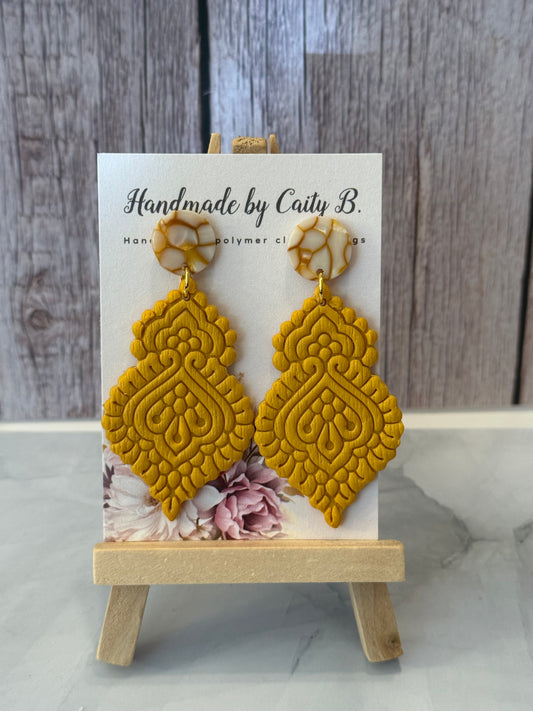 golden dangles with circle tops