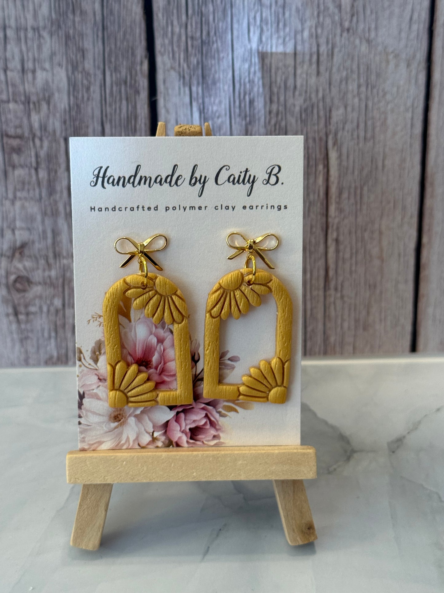 gold flowers with gold bow