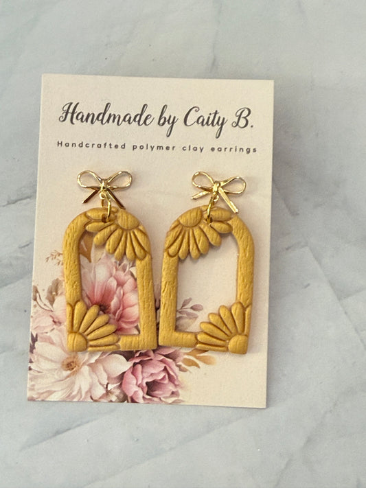 gold flowers with gold bow