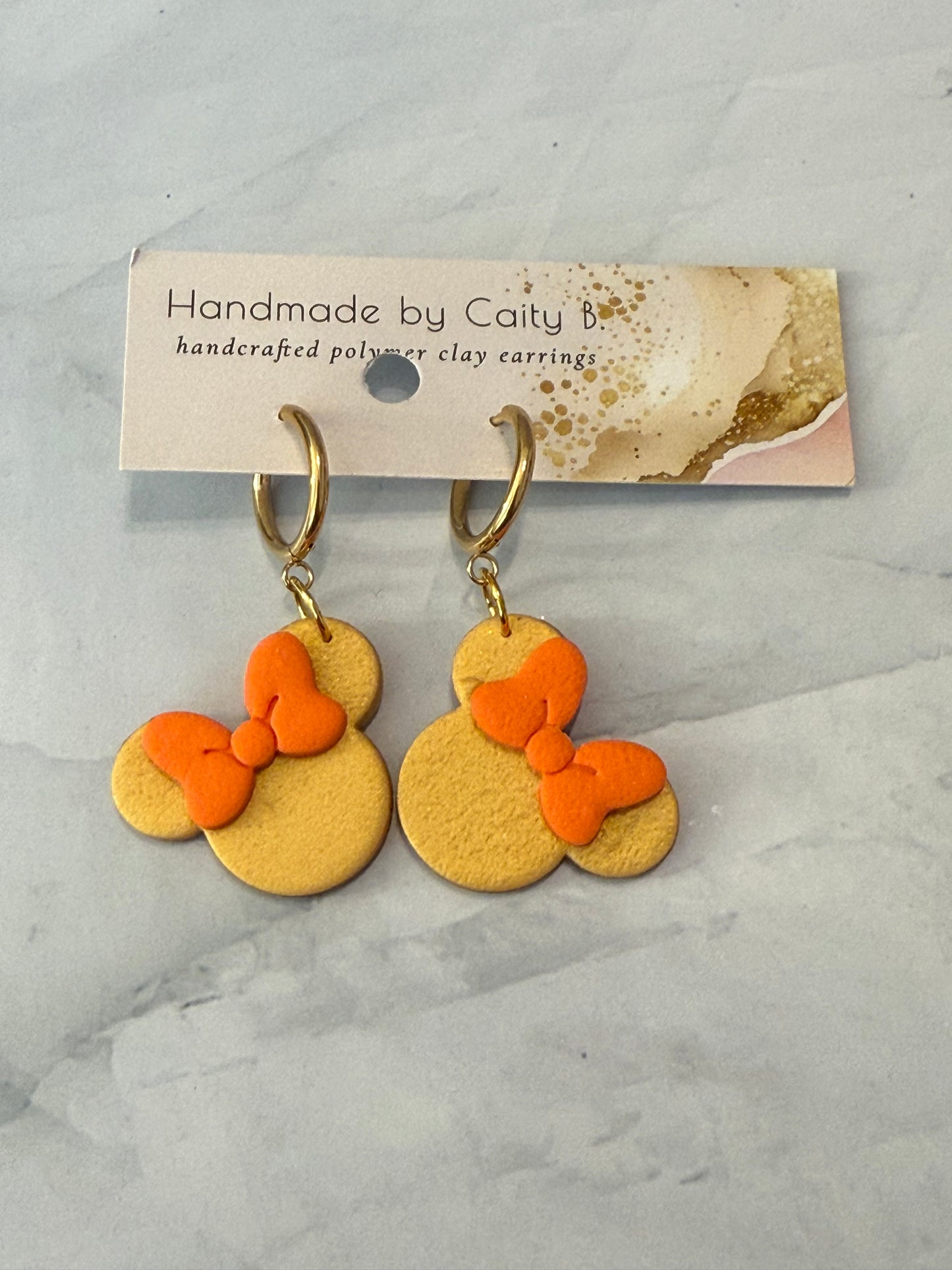 Mouse Inspired dangles with gold and orange bow