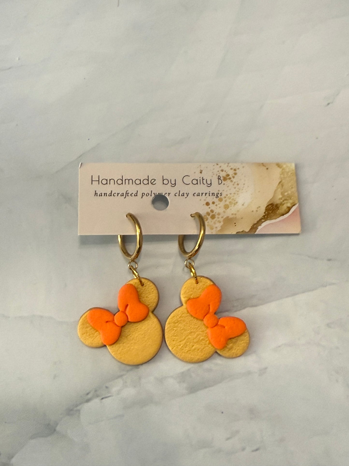Mouse Inspired dangles with gold and orange bow