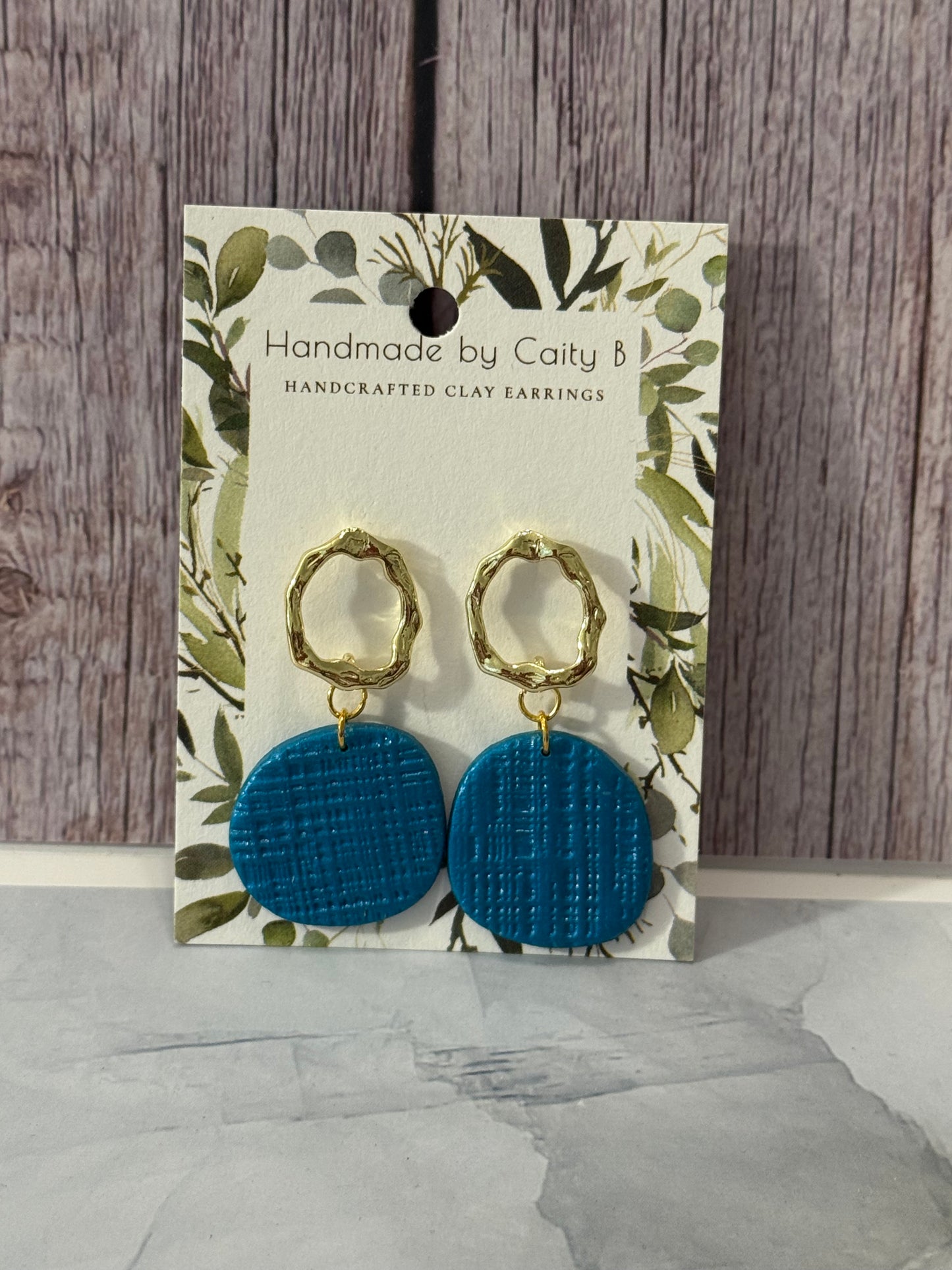 blue textured circles with gold circle tops