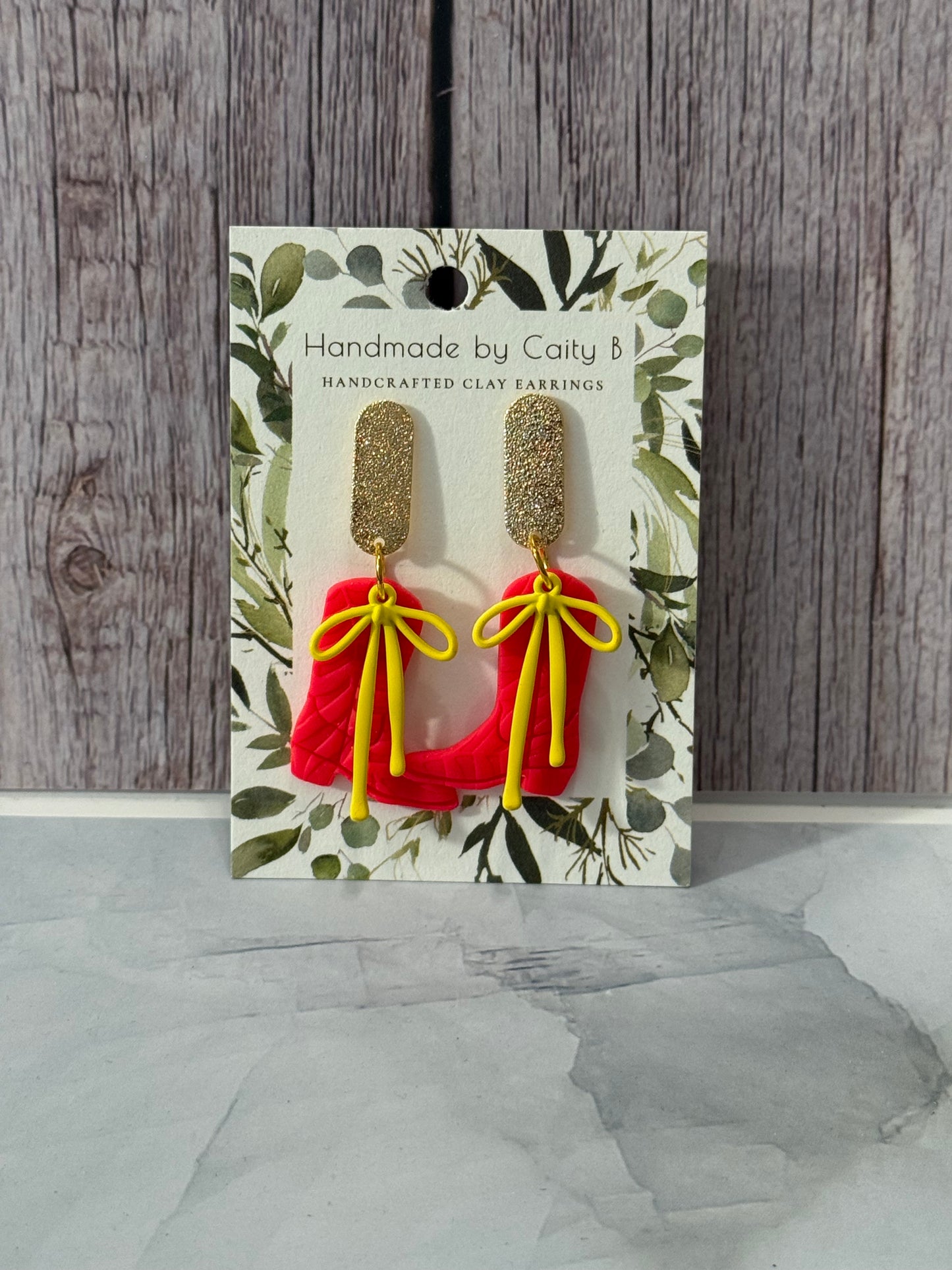 hot pink boots with yellow bows