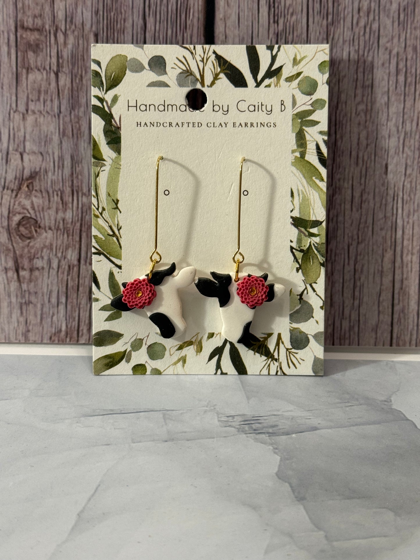 cows with pink flowers