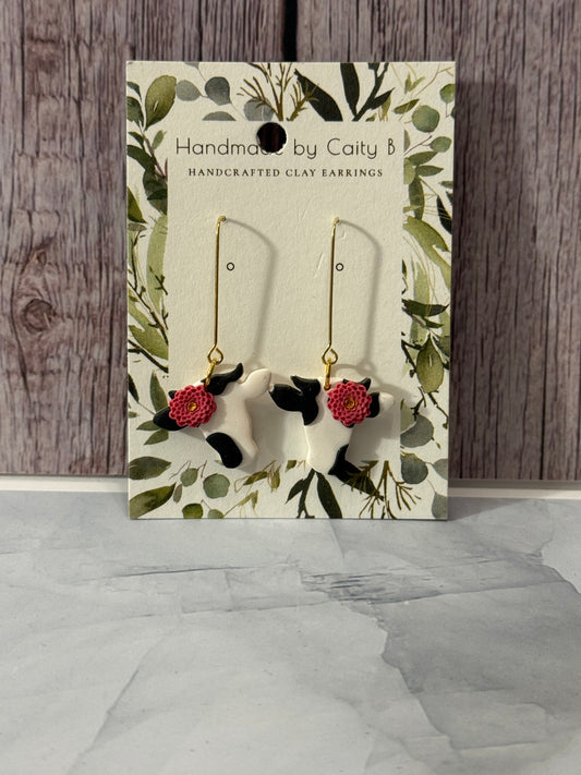 cows with pink flowers