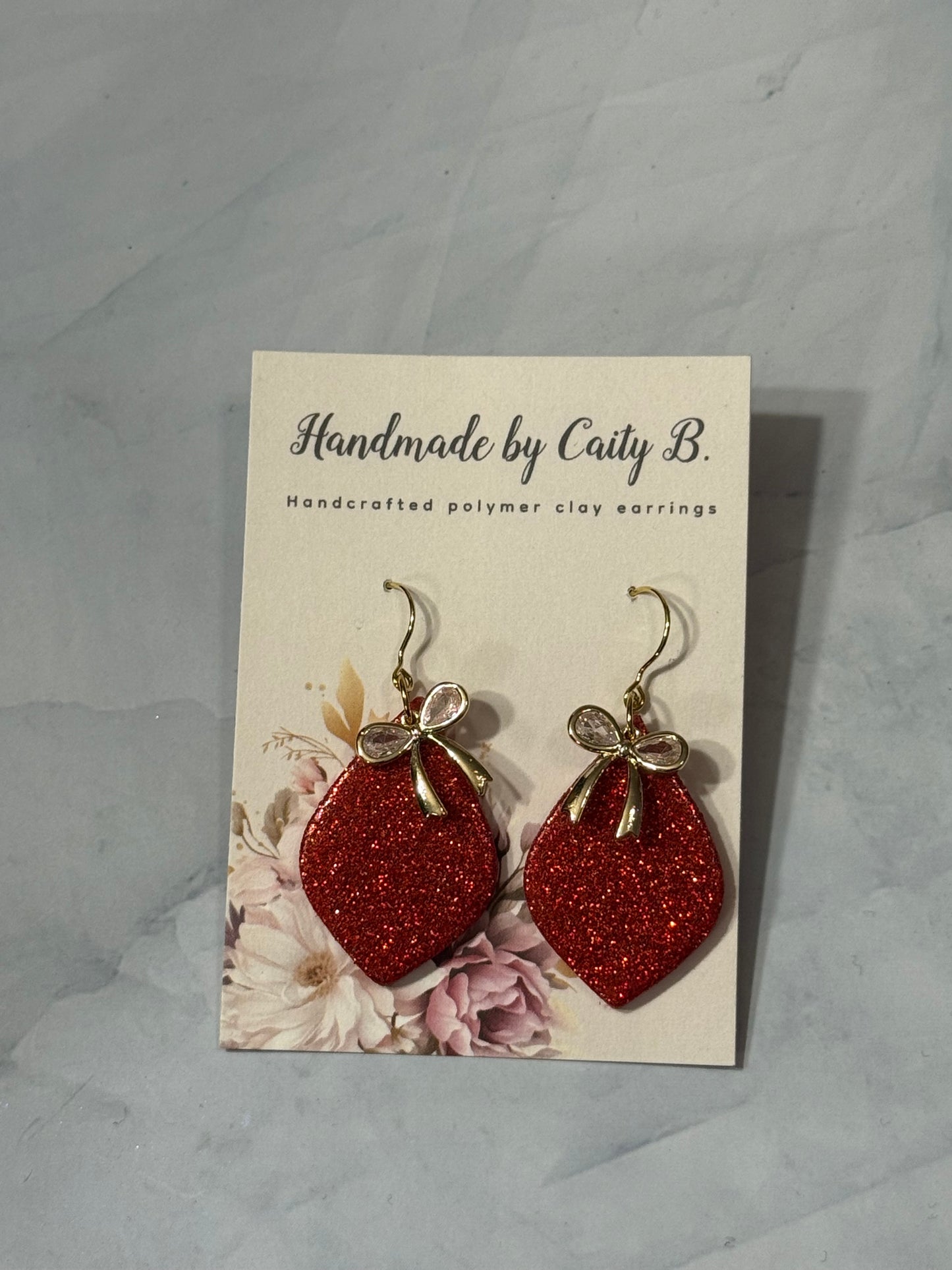 glitter red drop dangles with bow charm