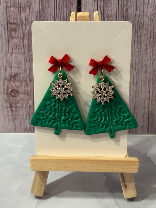 Christmas trees with snowflake charm and red bows