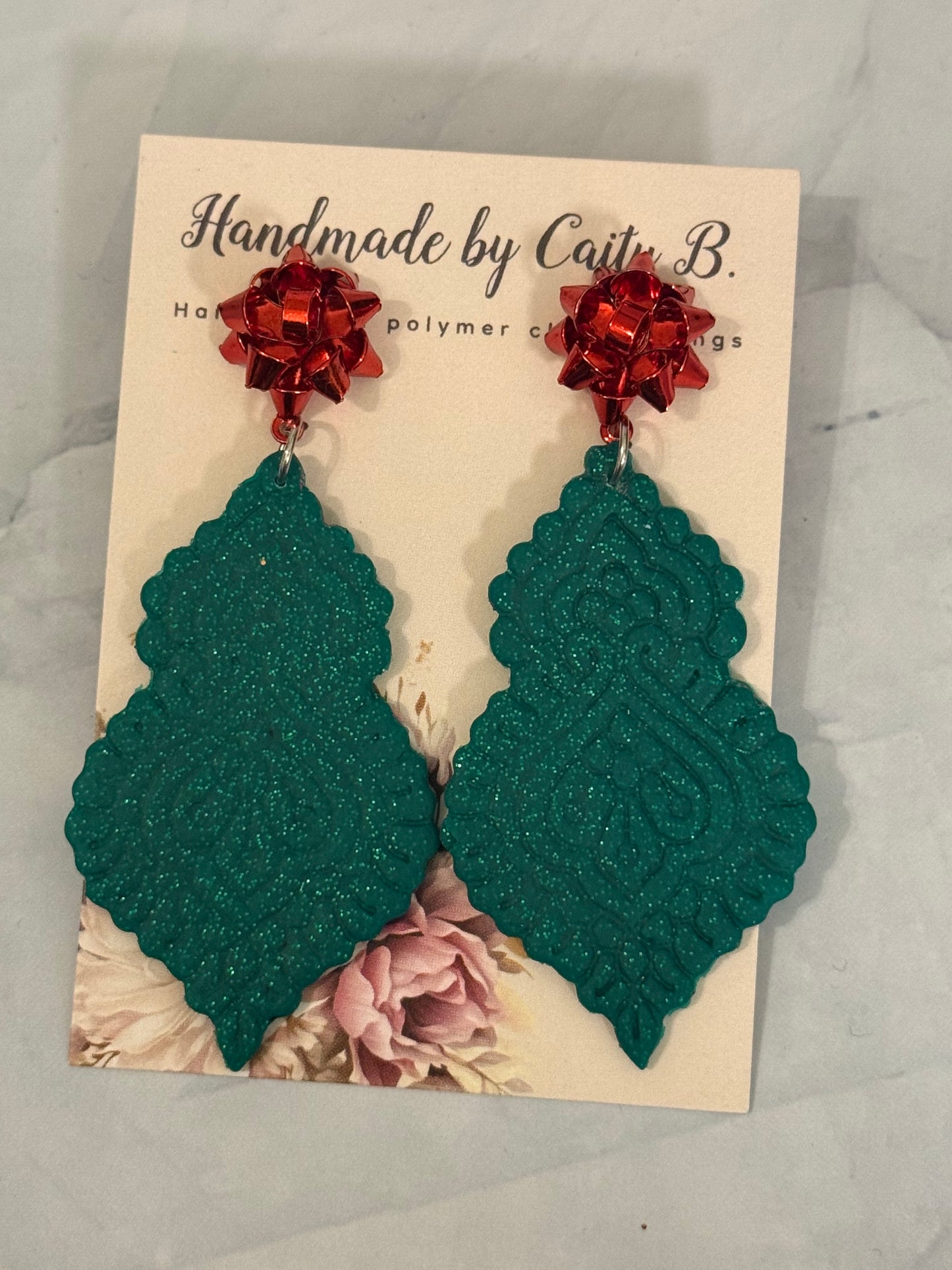 holiday sparkle with red bow tops