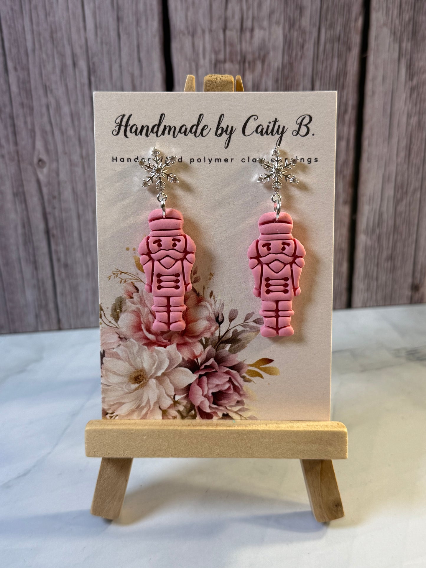 pink nutcrackers with snowflake tops