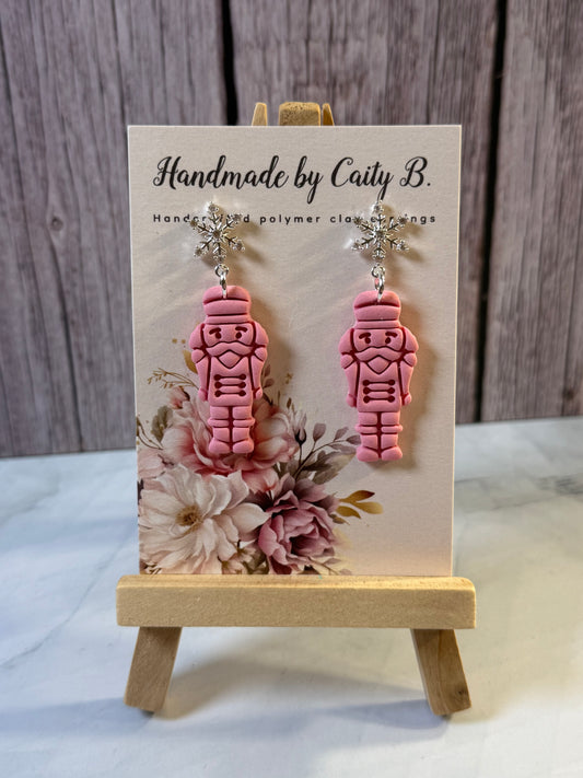 pink nutcrackers with snowflake tops