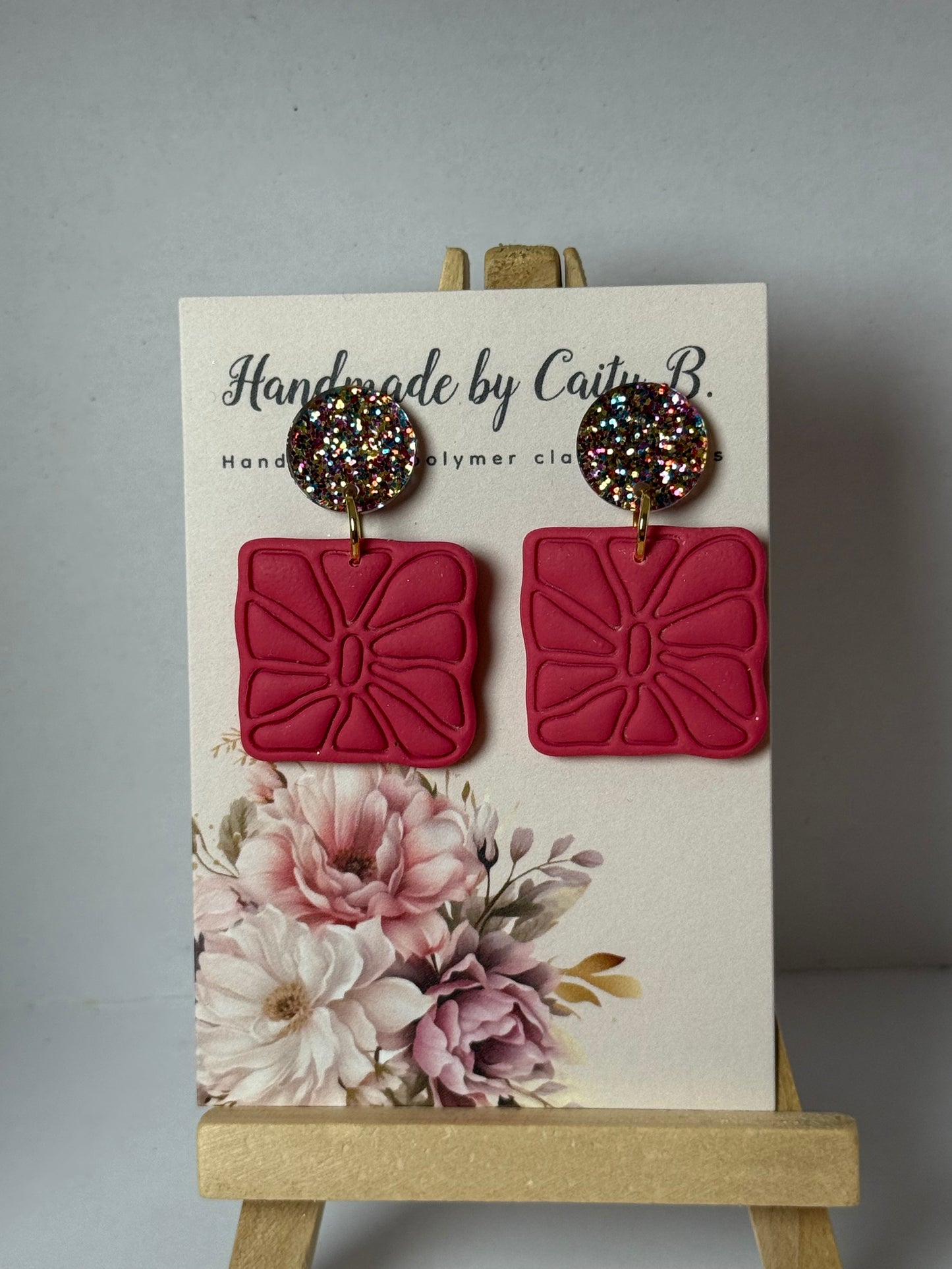 pink earrings with confetti tops