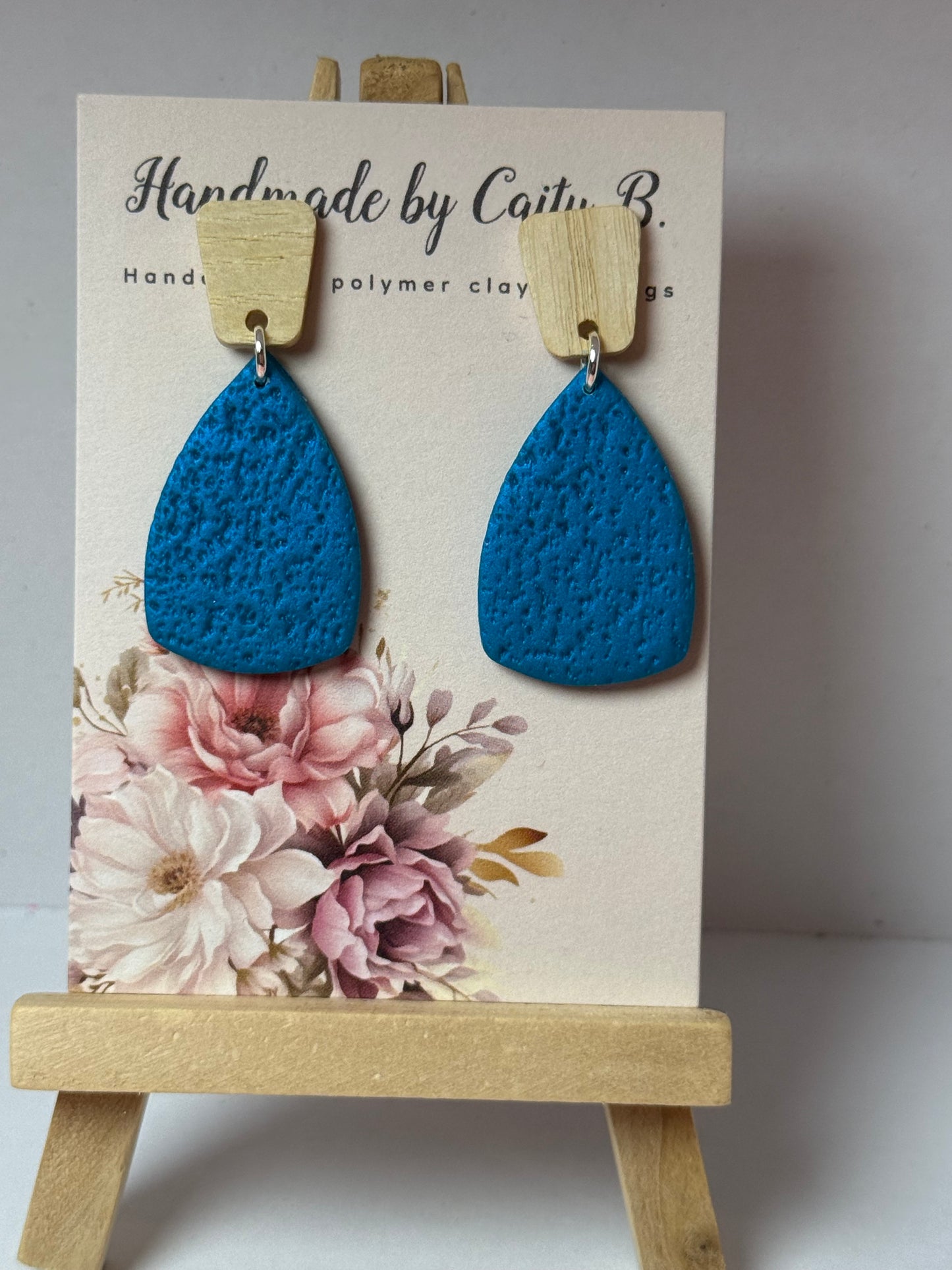 blue textured earrings with wooden tops
