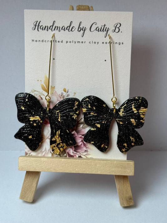 black and gold sparkle bows
