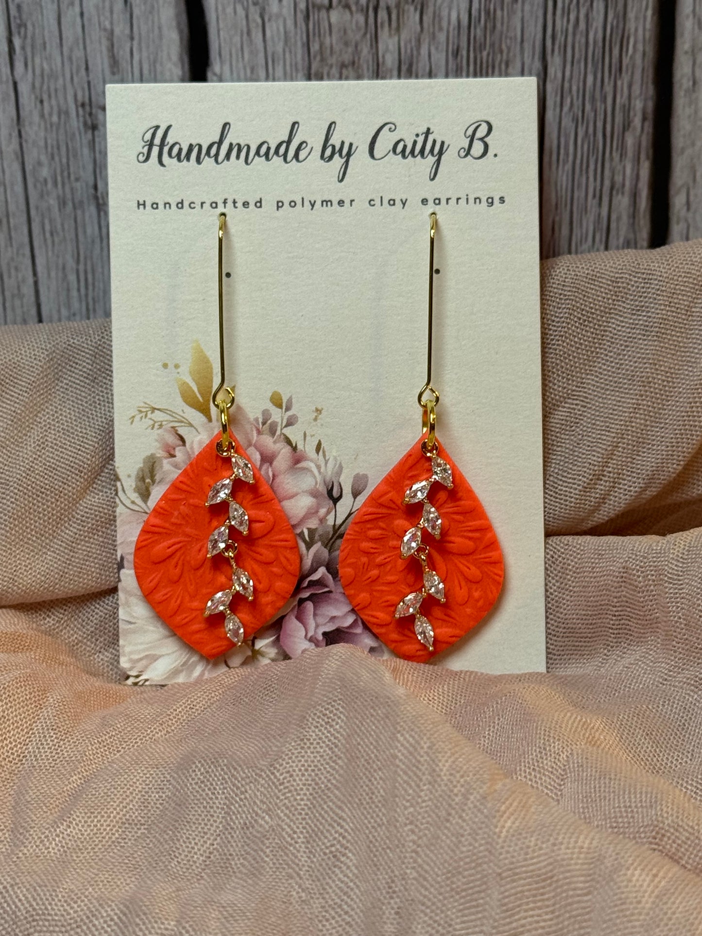 embossed floral drop dangles with rhinestone charm