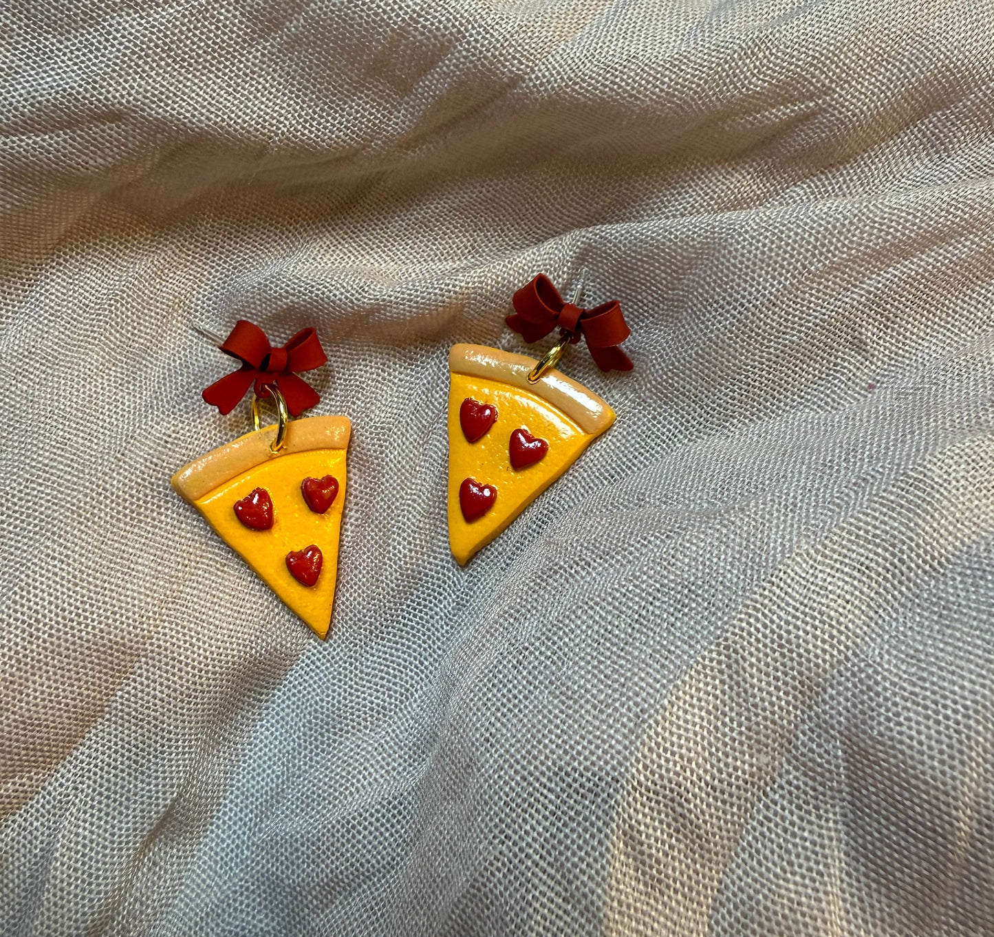 heart pepperoni pizzas with red bows