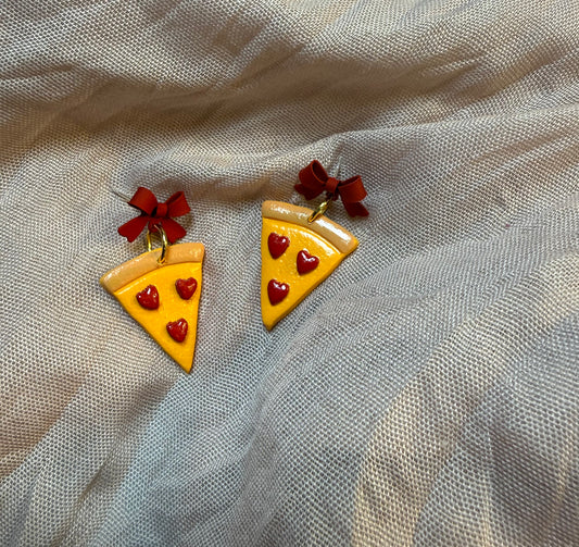 heart pepperoni pizzas with red bows