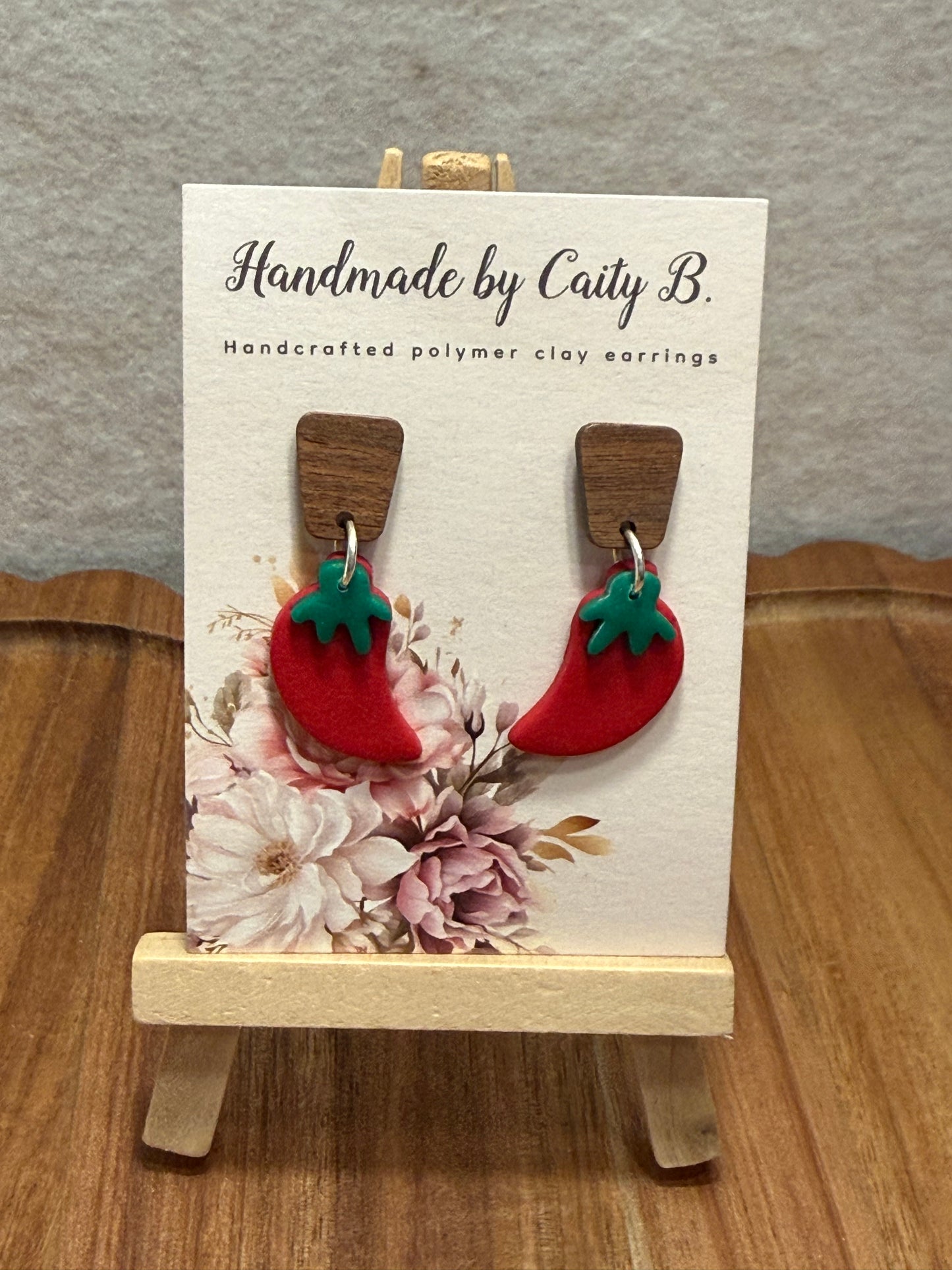 chili peppers with wooden tops