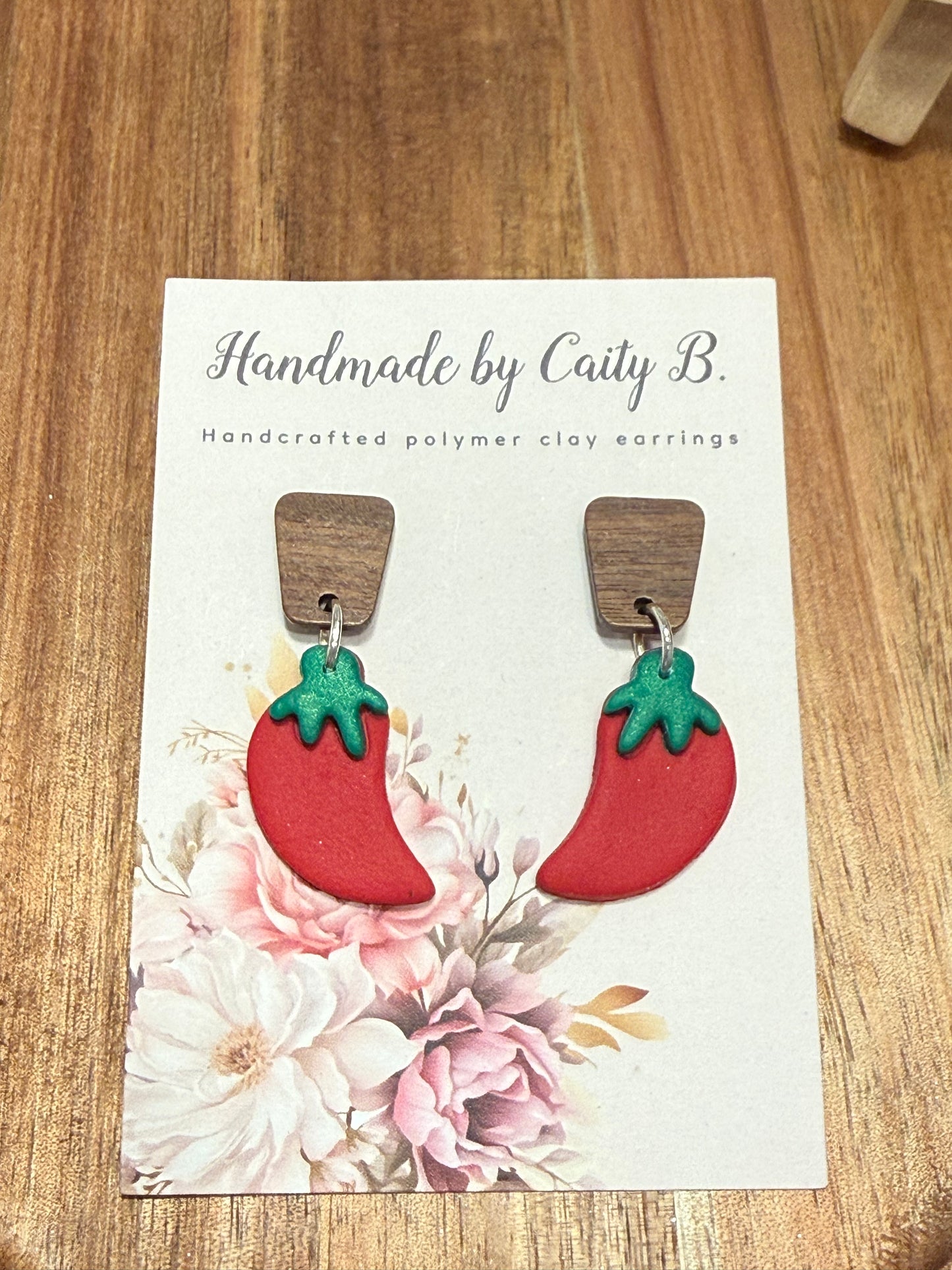 chili peppers with wooden tops