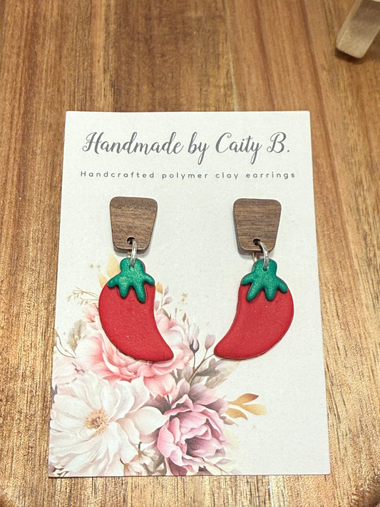 chili peppers with wooden tops