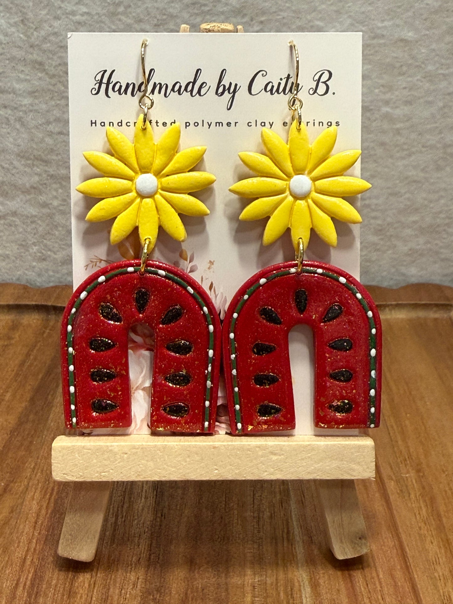 sparkle watermelon arches with yellow flowers and gold dangles