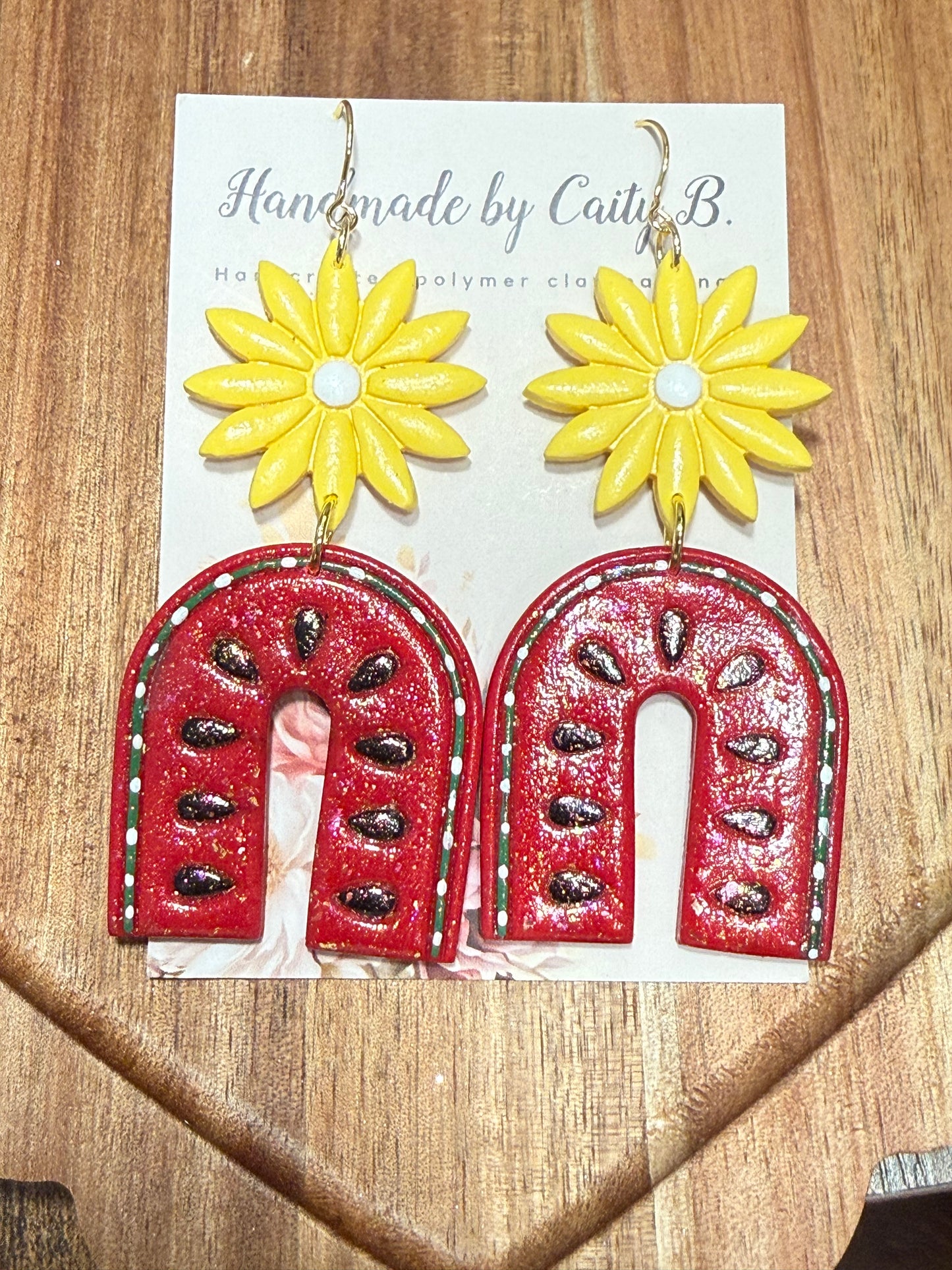 sparkle watermelon arches with yellow flowers and gold dangles